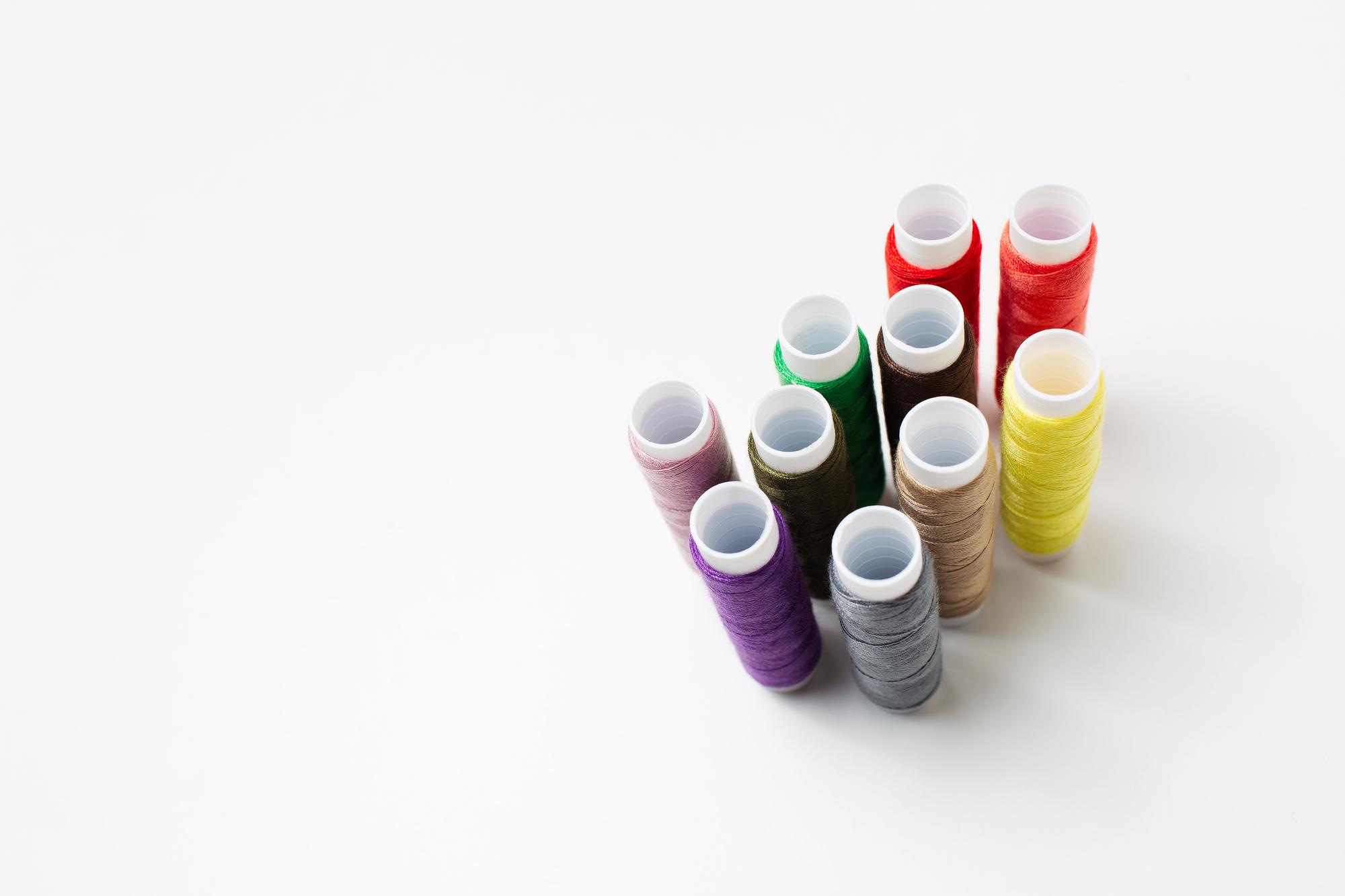 samples of embroidery threads and color swatches